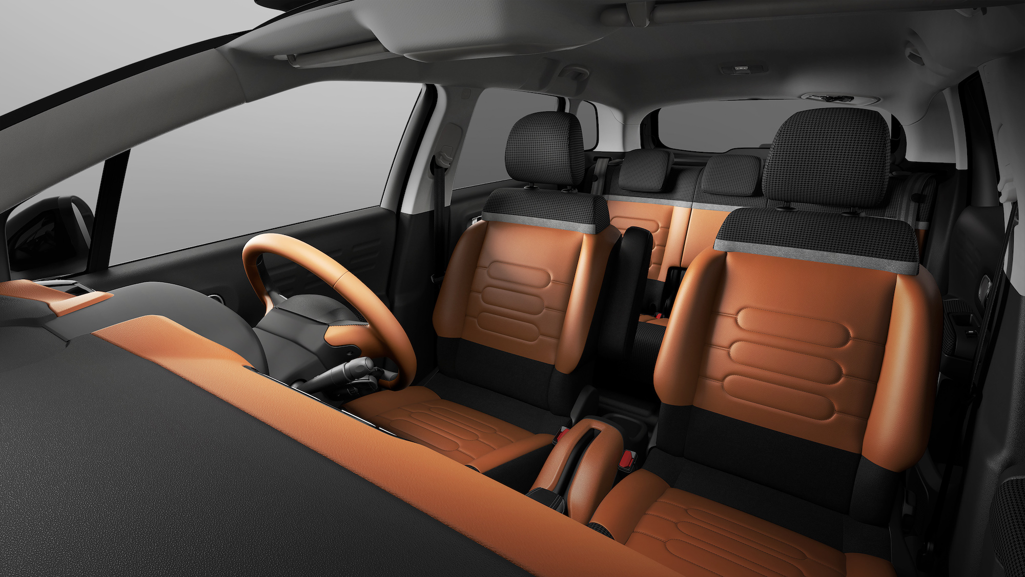 鮮やかなキャメルカラーのレザーと千鳥格子のファブリックでインテリア